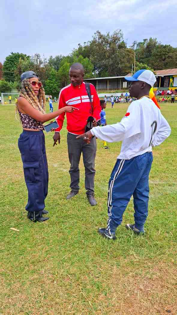 Coaches planning on the touchline — Unity Sports Club, Nanyuki