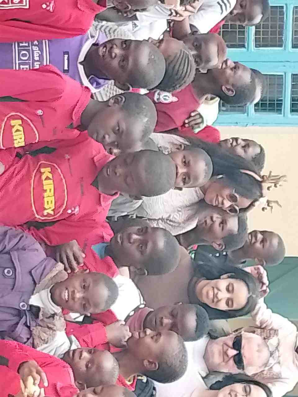 Community visit — the whole crew — Unity Sports Club, Nanyuki