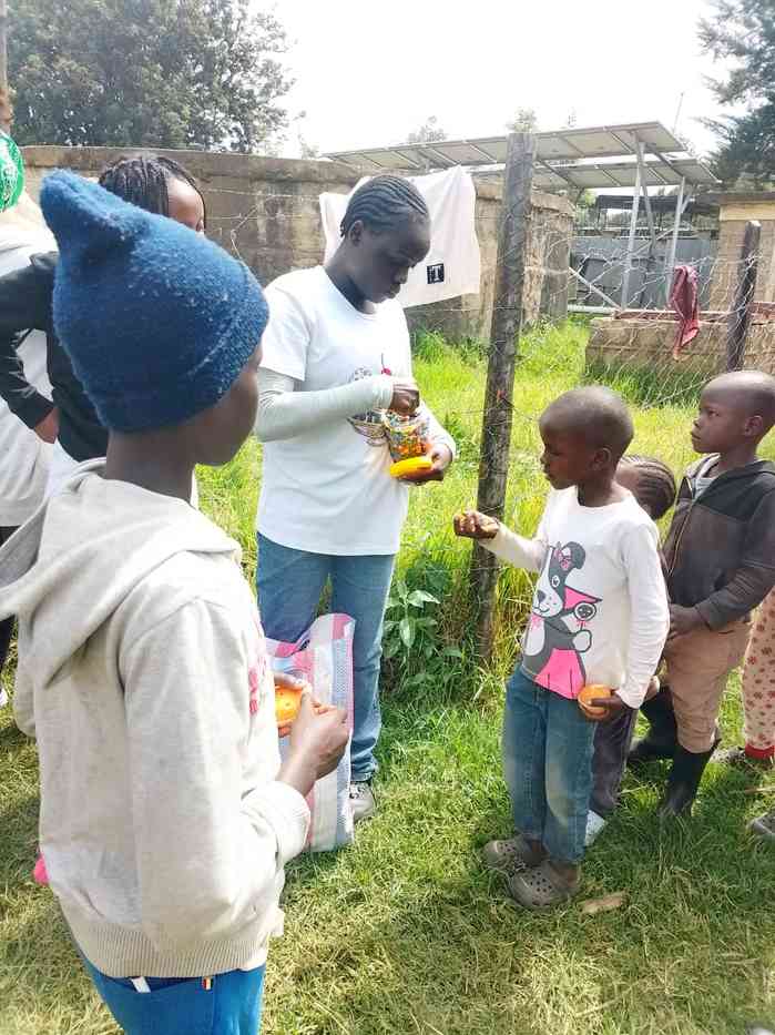 Fruit treats for the children — Unity Sports Club, Nanyuki