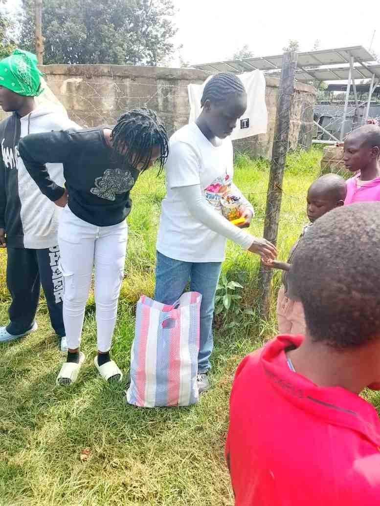 Unity youth distributing treats to children