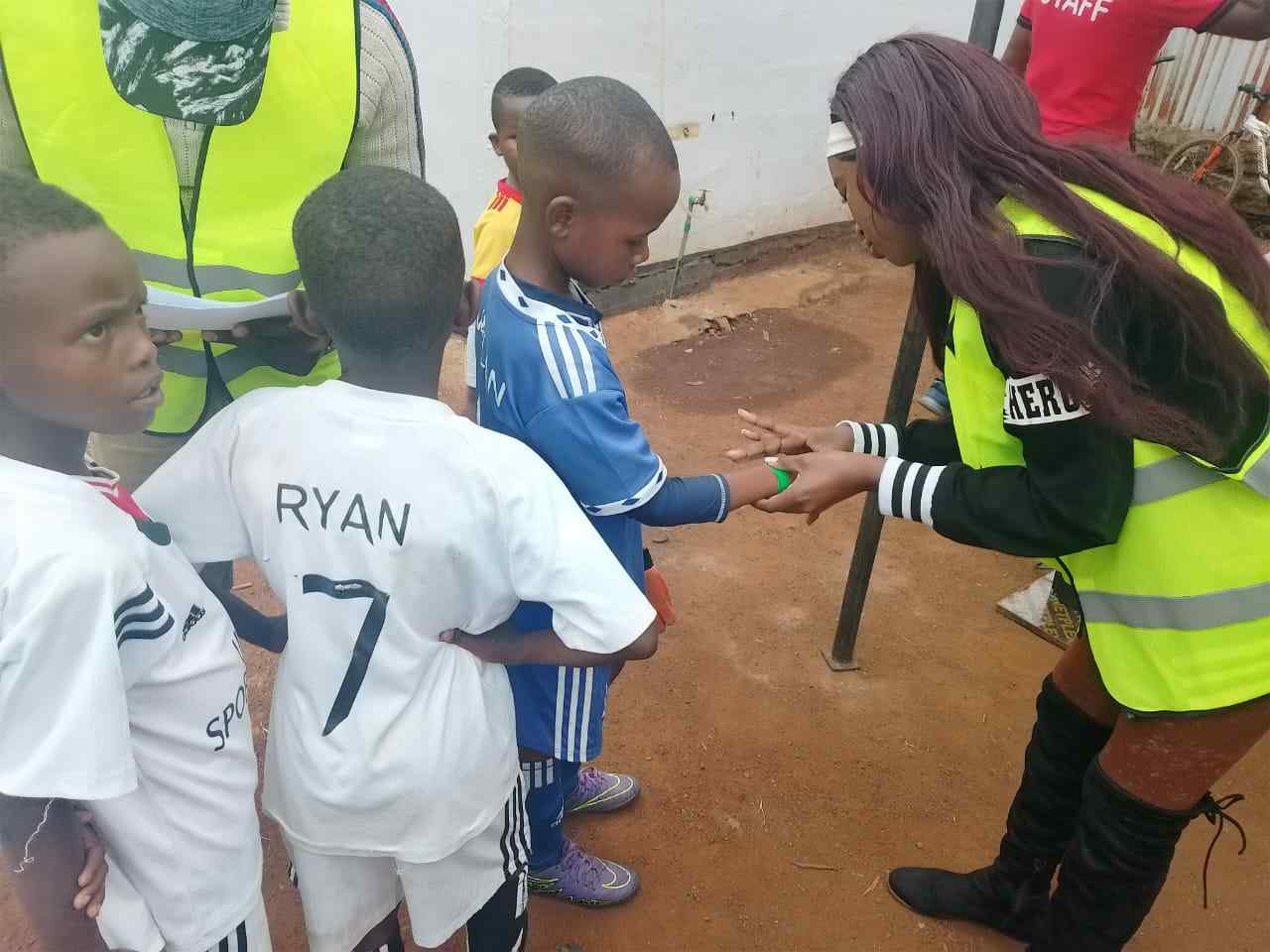 Hand sanitiser distribution — Unity Sports Club, Nanyuki