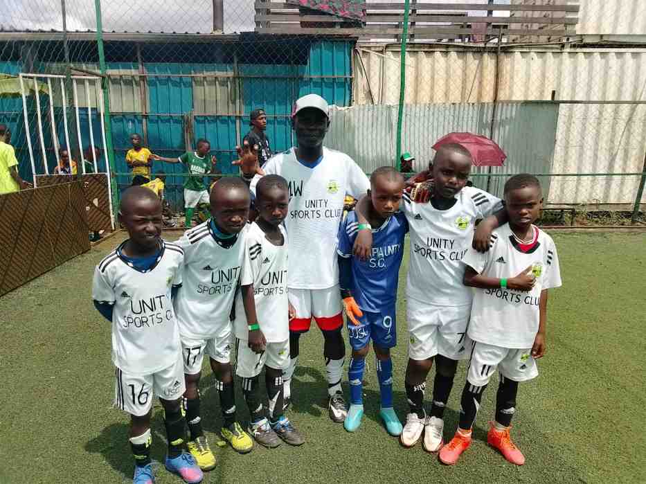 Coach and squad at the turf — Unity Sports Club, Nanyuki