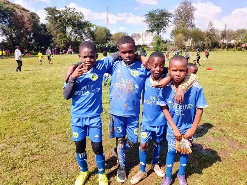 Peace signs before kick-off — Unity Sports Club, Nanyuki